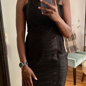 Black dress draped with fringes